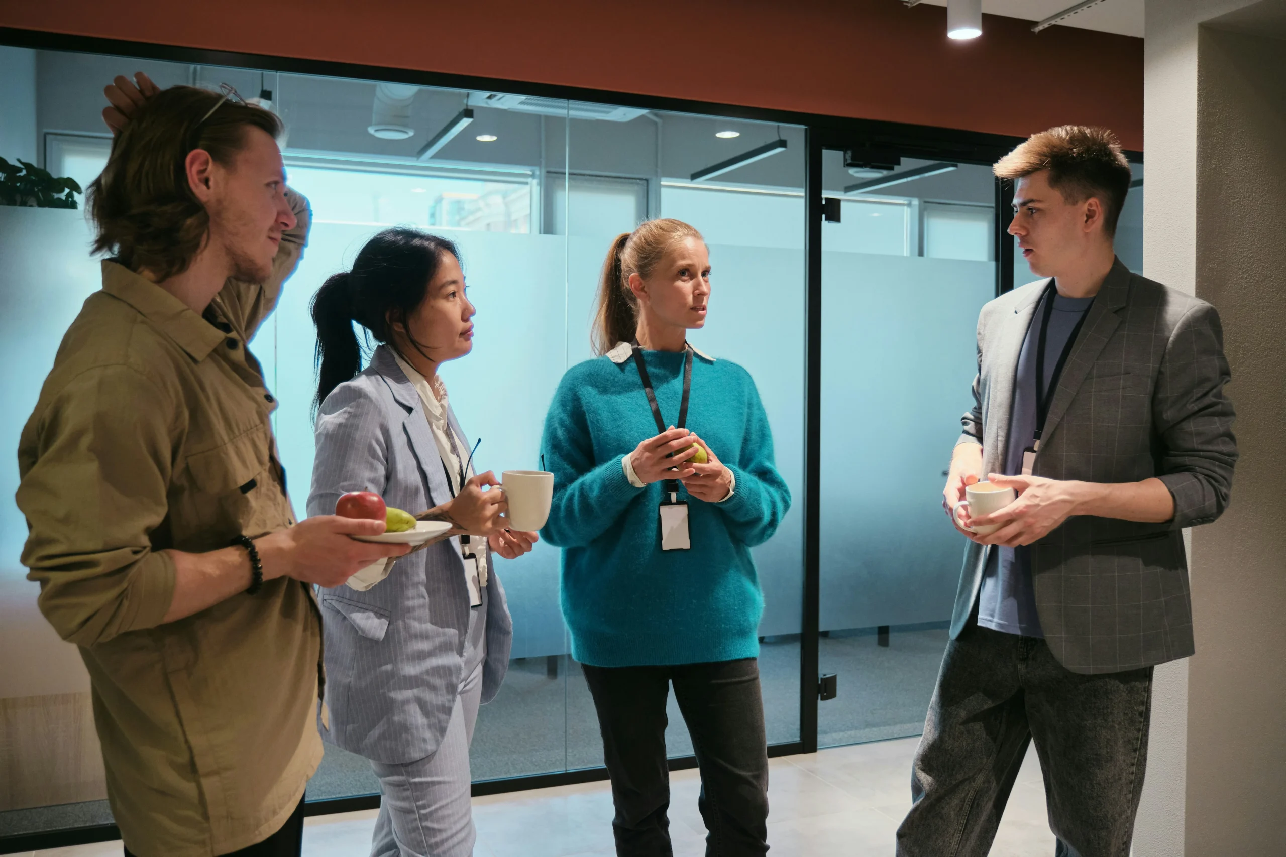 Quality and risk managers talking between sessions at a corporate training venue